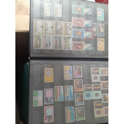 15 - Assorted stamp stock books and loose pages with mint and used QEII era Commonwealth, badly stored wi... 