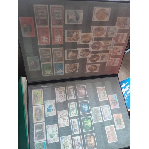 15 - Assorted stamp stock books and loose pages with mint and used QEII era Commonwealth, badly stored wi... 