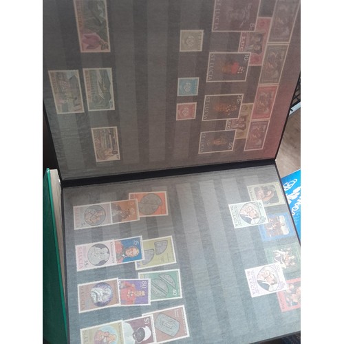 15 - Assorted stamp stock books and loose pages with mint and used QEII era Commonwealth, badly stored wi... 