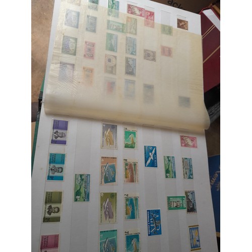 15 - Assorted stamp stock books and loose pages with mint and used QEII era Commonwealth, badly stored wi... 