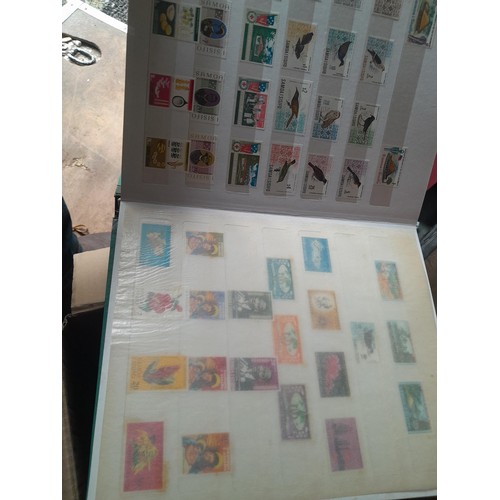 15 - Assorted stamp stock books and loose pages with mint and used QEII era Commonwealth, badly stored wi... 