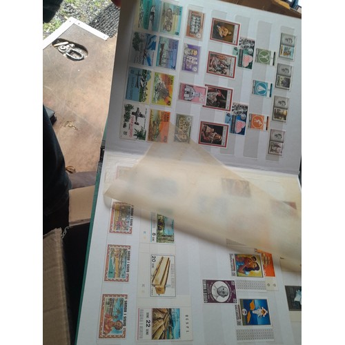 15 - Assorted stamp stock books and loose pages with mint and used QEII era Commonwealth, badly stored wi... 