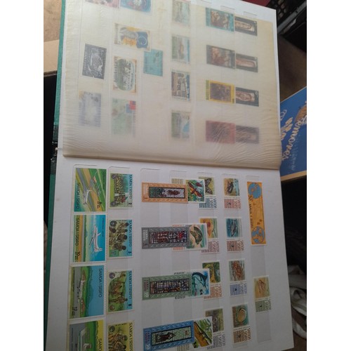 15 - Assorted stamp stock books and loose pages with mint and used QEII era Commonwealth, badly stored wi... 