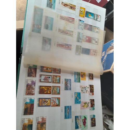 15 - Assorted stamp stock books and loose pages with mint and used QEII era Commonwealth, badly stored wi... 