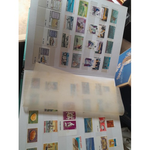 15 - Assorted stamp stock books and loose pages with mint and used QEII era Commonwealth, badly stored wi... 