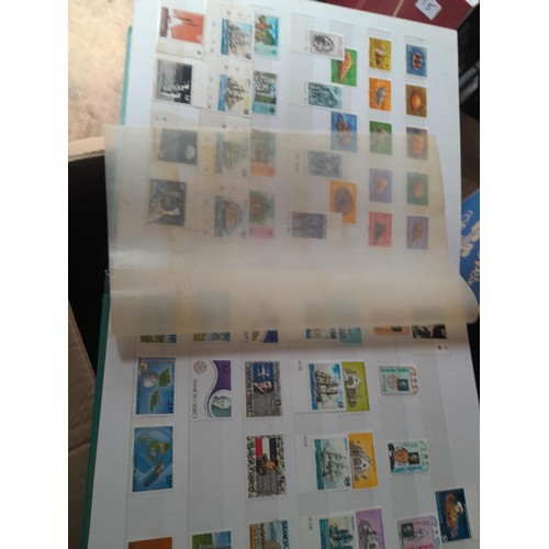 15 - Assorted stamp stock books and loose pages with mint and used QEII era Commonwealth, badly stored wi... 