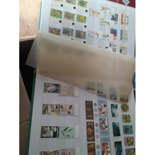 15 - Assorted stamp stock books and loose pages with mint and used QEII era Commonwealth, badly stored wi... 