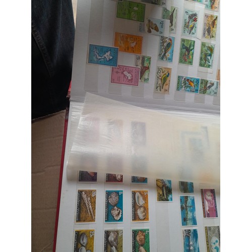 15 - Assorted stamp stock books and loose pages with mint and used QEII era Commonwealth, badly stored wi... 