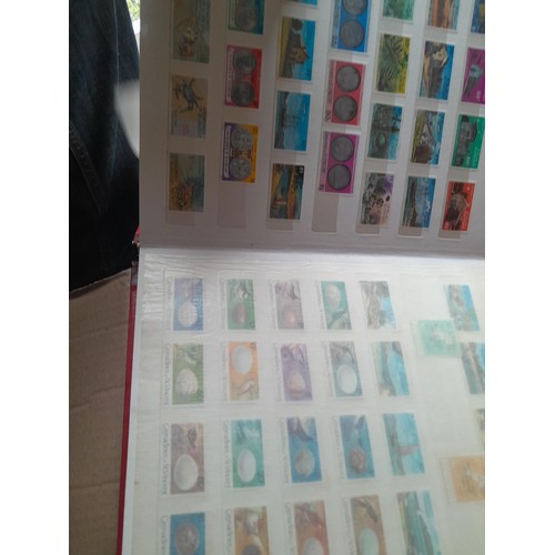 15 - Assorted stamp stock books and loose pages with mint and used QEII era Commonwealth, badly stored wi... 