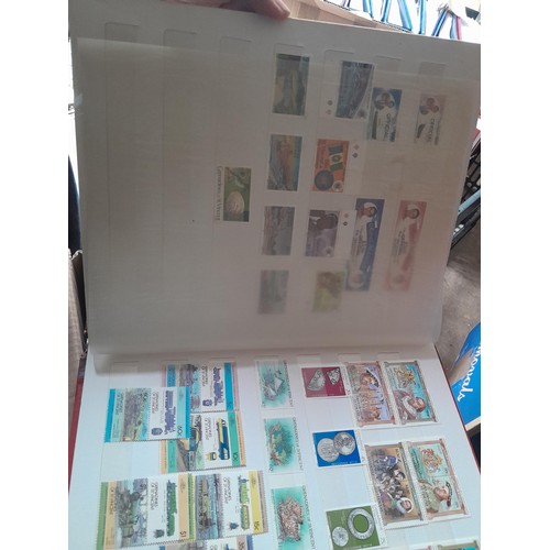 15 - Assorted stamp stock books and loose pages with mint and used QEII era Commonwealth, badly stored wi... 