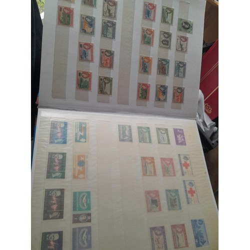 15 - Assorted stamp stock books and loose pages with mint and used QEII era Commonwealth, badly stored wi... 