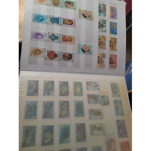 15 - Assorted stamp stock books and loose pages with mint and used QEII era Commonwealth, badly stored wi... 