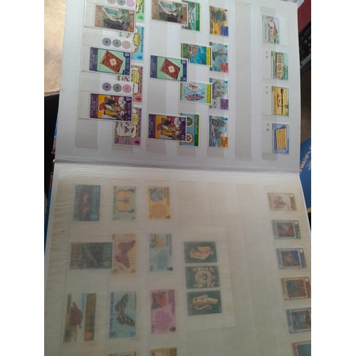 15 - Assorted stamp stock books and loose pages with mint and used QEII era Commonwealth, badly stored wi... 