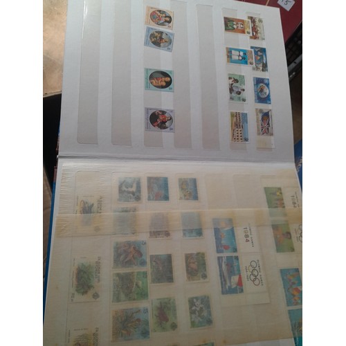 15 - Assorted stamp stock books and loose pages with mint and used QEII era Commonwealth, badly stored wi... 