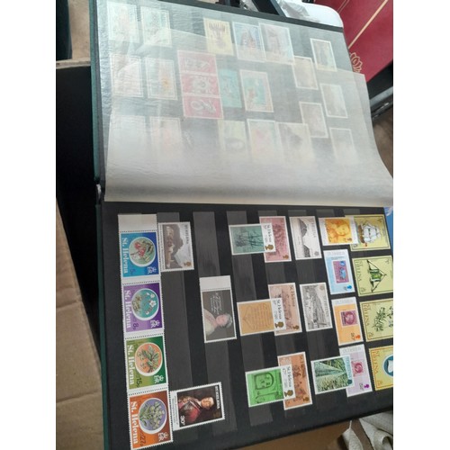 15 - Assorted stamp stock books and loose pages with mint and used QEII era Commonwealth, badly stored wi... 