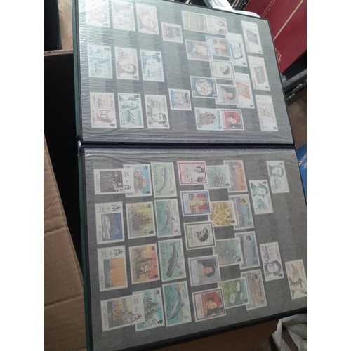 15 - Assorted stamp stock books and loose pages with mint and used QEII era Commonwealth, badly stored wi... 