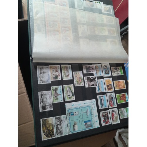 15 - Assorted stamp stock books and loose pages with mint and used QEII era Commonwealth, badly stored wi... 