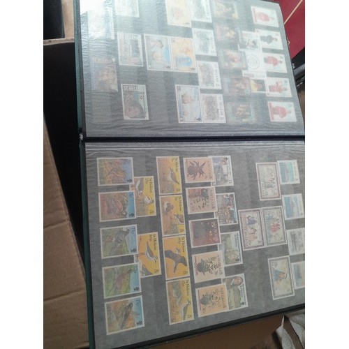 15 - Assorted stamp stock books and loose pages with mint and used QEII era Commonwealth, badly stored wi... 