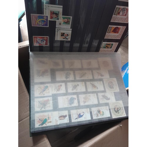 15 - Assorted stamp stock books and loose pages with mint and used QEII era Commonwealth, badly stored wi... 