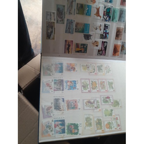 15 - Assorted stamp stock books and loose pages with mint and used QEII era Commonwealth, badly stored wi... 