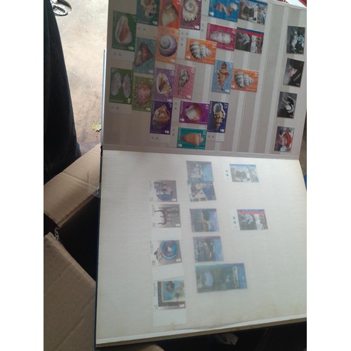 15 - Assorted stamp stock books and loose pages with mint and used QEII era Commonwealth, badly stored wi... 