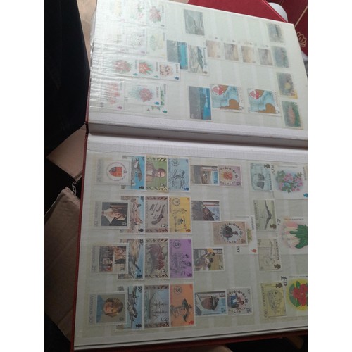 15 - Assorted stamp stock books and loose pages with mint and used QEII era Commonwealth, badly stored wi... 