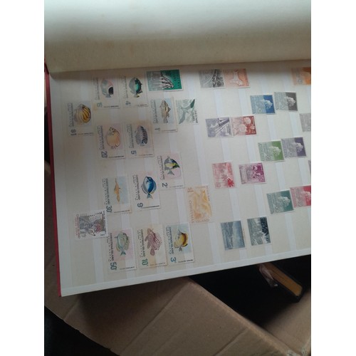 15 - Assorted stamp stock books and loose pages with mint and used QEII era Commonwealth, badly stored wi... 