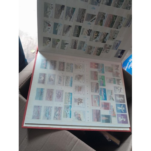 15 - Assorted stamp stock books and loose pages with mint and used QEII era Commonwealth, badly stored wi... 