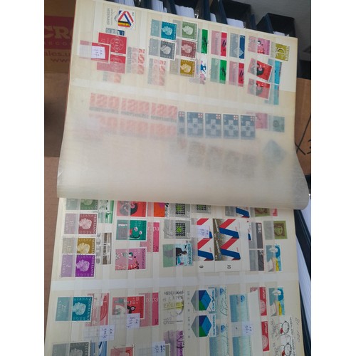 23 - 3 x stock books with a large accumulation of stamps of the Netherlands, a few used but mainly unmoun... 