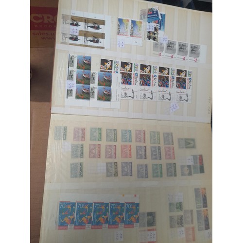 23 - 3 x stock books with a large accumulation of stamps of the Netherlands, a few used but mainly unmoun... 