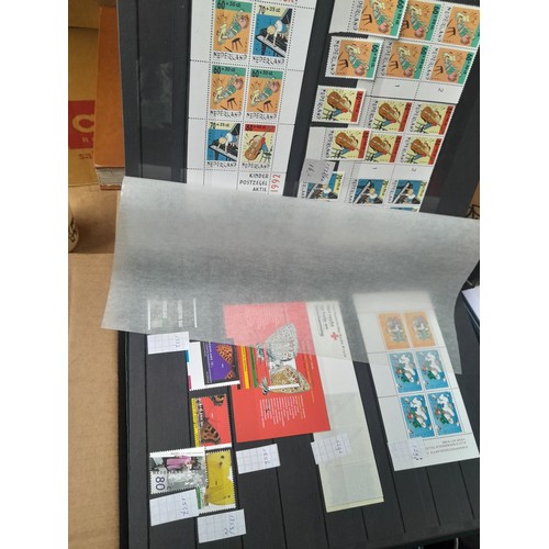 23 - 3 x stock books with a large accumulation of stamps of the Netherlands, a few used but mainly unmoun... 