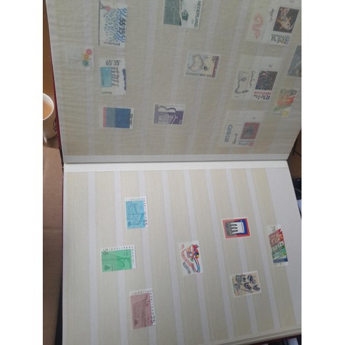 23 - 3 x stock books with a large accumulation of stamps of the Netherlands, a few used but mainly unmoun... 