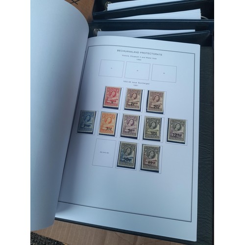 24 - Stamps of British Africa, 11 clean folders with printed pages for various countries either empty or ... 