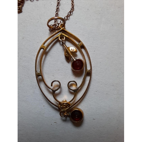 40 - Unmarked but tested 9 ct gold pendant on chain set with 2 x rubies and single pearl 3.3 g