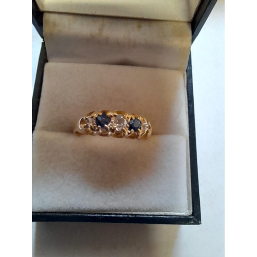 63 - 18 ct three diamond and two sapphire ring size P, 2.5 g