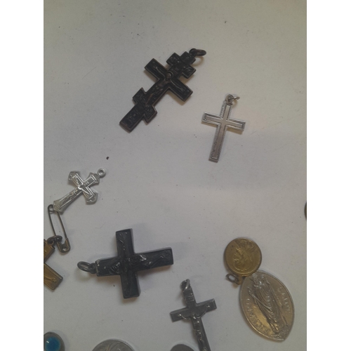 69 - Catholic related jewellery, crosses religious tokens etc.