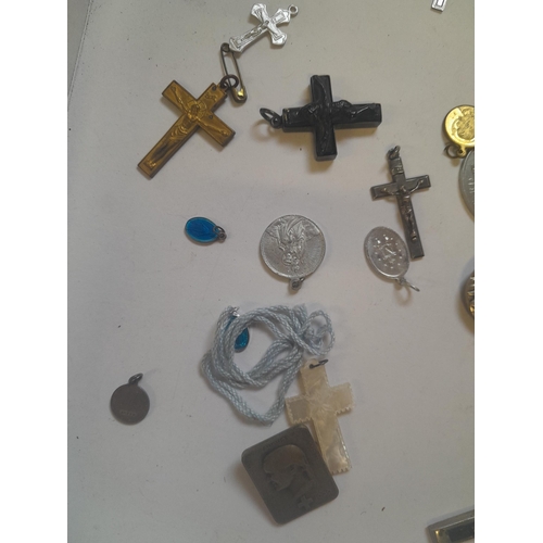 69 - Catholic related jewellery, crosses religious tokens etc.