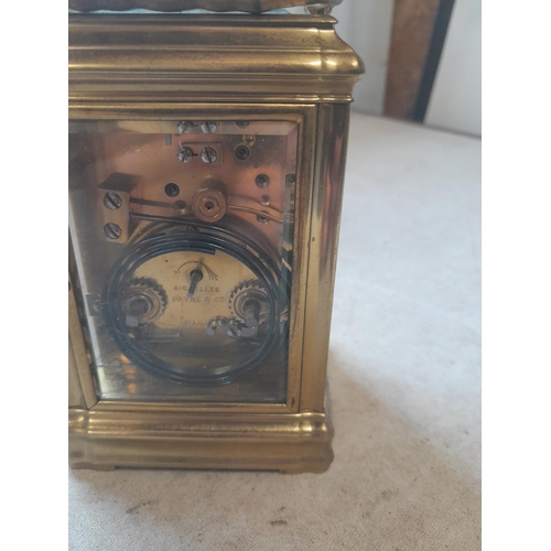 122 - Early 20th century French striking mantle / carriage clock in brass and bevelled glass case with key... 