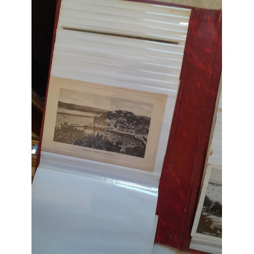 204 - Postcards : early - mid coloured and black and white postcards relating to Torquay & sparsely filled... 