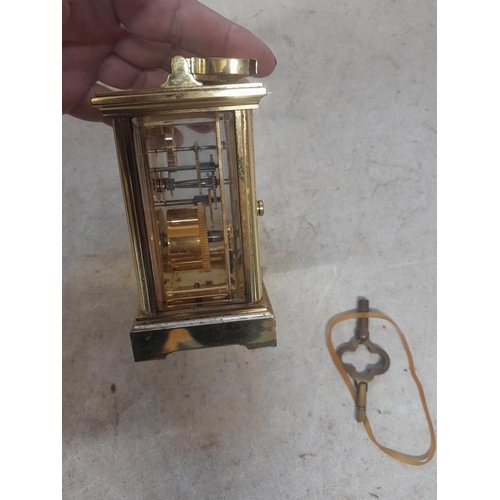 130 - Vintage brass and bevelled glass carriage clock retailed through Taylor and Bligh