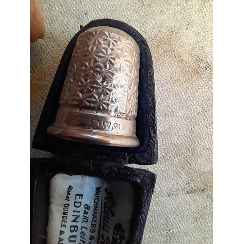 132 - Silver thimble in case with a vintage compass