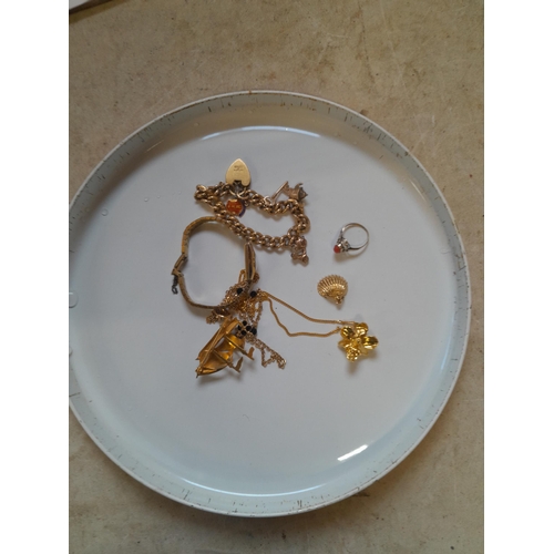 181 - Rolled and filled gold and plated jewellery including charm bracelet