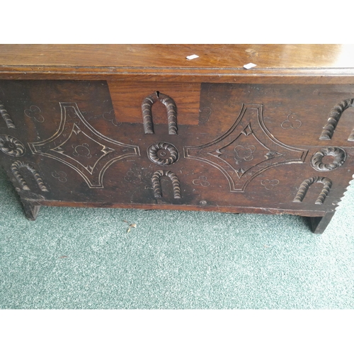 47 - Late 17th / early 18th century oak plank coffer of small proportion with later carving, lid and lock