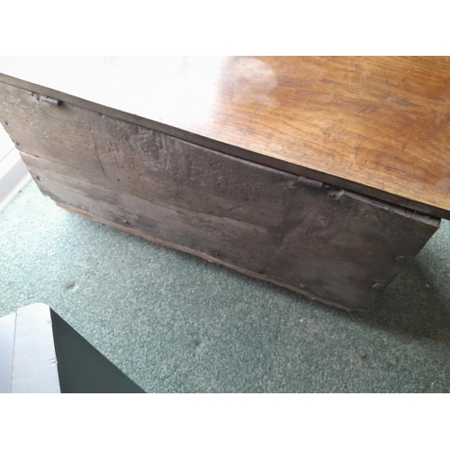 47 - Late 17th / early 18th century oak plank coffer of small proportion with later carving, lid and lock