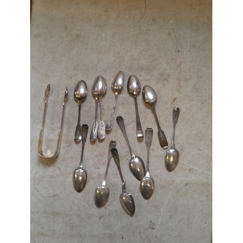 326 - Silver tea spoons and sugar nips , differing assay offices, dates and makers 224 g