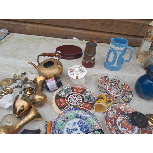 48 - Assorted posters, brass ware, bone ornaments, damaged Doulton jug, vintage advertising etc.