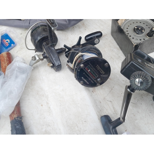 68 - Fishing tackle and reels 2 x Triton Speedmaster multipliers, 1 x ABU Cardinal 1 x trout reel J W You... 