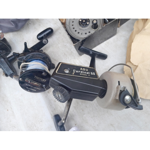 68 - Fishing tackle and reels 2 x Triton Speedmaster multipliers, 1 x ABU Cardinal 1 x trout reel J W You... 