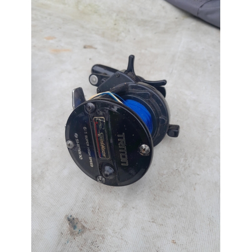 68 - Fishing tackle and reels 2 x Triton Speedmaster multipliers, 1 x ABU Cardinal 1 x trout reel J W You... 