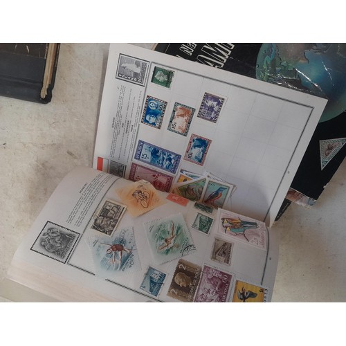 85 - A world Collection of mainly used stamps, some mint noticed, school boy collections in well and part... 